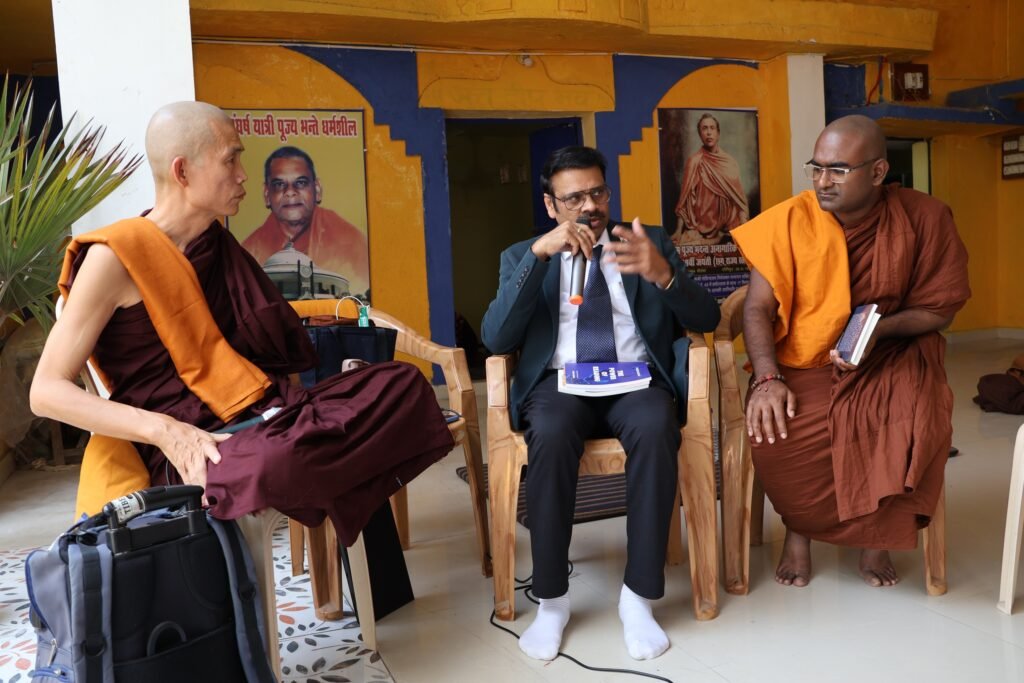 Rusen Kumar Explaining about his work to Vipassana Meditation Master Dr. Ashin Ottamathara Buddhist Monk